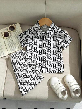 SHEIN Leap Crew مجموعة من 2 قطعة للأطفال الصبية/البنات - ملابس علوية بياقة بولو محبوكة وشورت بخصر مطاطي، بدلة كاجوال مناسبة للاستخدام الداخلي والخارجي في فصلي الربيع والصيف