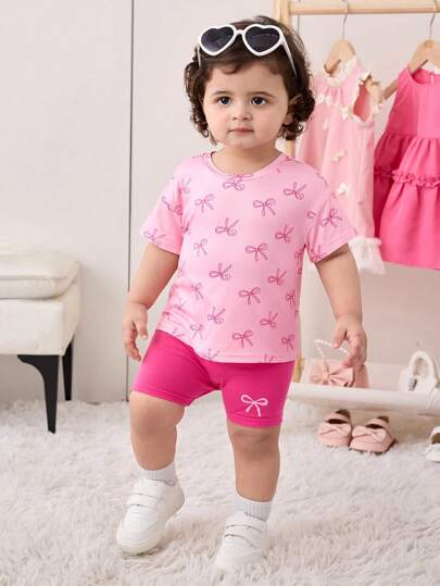 طقم قميص أكمام قصيرة وشورت ذو خصر مطاطي، وردي اللون، عقدة الفراشة جميل للبنات الرضع مناسب للصيف