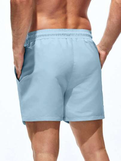 Manfinity Swimmode شورتات شاطئ ذات لون أحادي مع جيب وخصر رباط، مناسبة للصيف