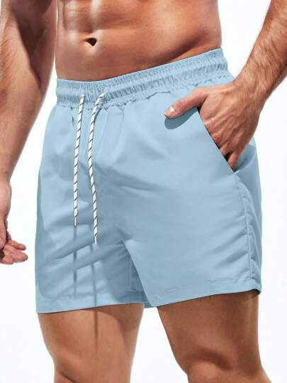 Manfinity Swimmode شورتات شاطئ ذات لون أحادي مع جيب وخصر رباط، مناسبة للصيف