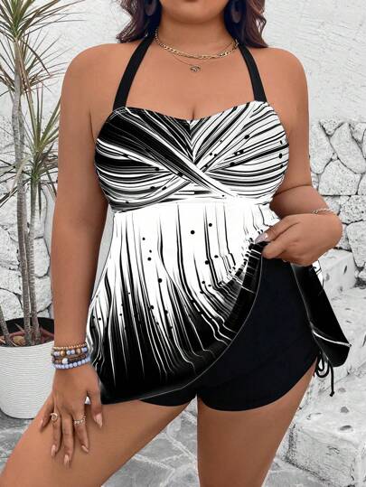Swim Lushoire الحجم الكبير مجموعة من 2 قطع: ملابس علوية مطبوعة وشورت ذو خصر مرتفع باللون الأحادي مع خيط جانبي، خصر ملابس علوية عالي مفتوح الظهر بأربطة رفيعة متقاطعة، بدلة سباحة بأسلوب كاجوال