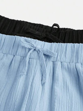 SHEIN مجموعة قطعتين للبنات المراهقات: بنطلون فضفاض ذو نسيج متشابك، وقميص مزين بعقدة الربطة، أسلوب عطلة عادي