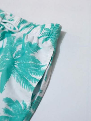 Manfinity Swimmode بدلة سباحة رجالية مريحة مع جيوب وطباعة شجرة النخيل ذات خصر مطاطي وسحاب ، طراز هاواي