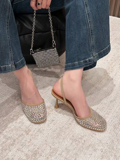 Xin Jing Shoes أحذية نسائية أنيقة ذات كعب عالي، كاجوال وجذاب بتصميم عصري، برؤوس مستديرة مرصعة بالراين ستون وظهر مفرغ، كعب متوسط مناسب للتنقل والمواعدة