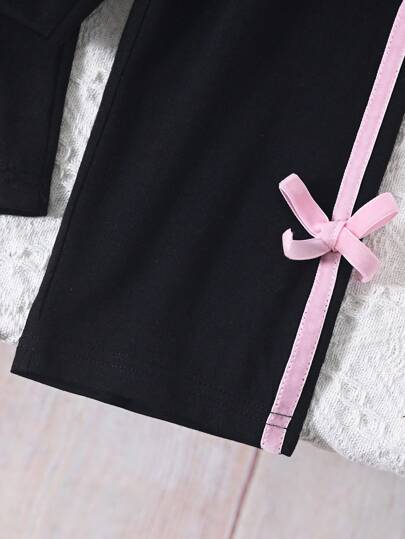 SHEIN مجموعة فستان من 2 قطعة للبنات صيف ربيع، ملابس علوية قصيرة الأكمام ذات ياقة دائرية باللون الأسود أنيقة مزينة بفيونكة زهرية واللون الوردي وبنطلون مطابق، مناسب للعب في الخارج والاستخدام اليومي