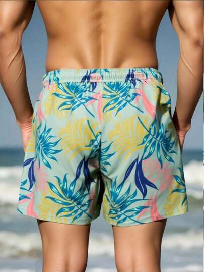 Manfinity Swimmode شورت شاطئ عصري بخصر رباط مطبوع بنمط نباتات استوائية للرجال، شورت شاطئ كاجوال ولطيف للخارج والشاطئ، طراز هاواي