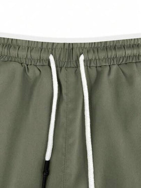 Manfinity Homme شورتات كاجوال رجالية سادة بخصر مطاطي وجيوب للشارع