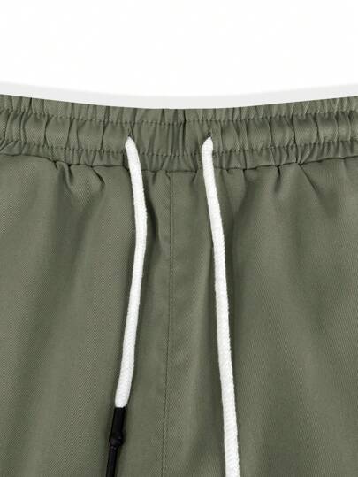 Manfinity Homme شورتات كاجوال رجالية سادة بخصر مطاطي وجيوب للشارع