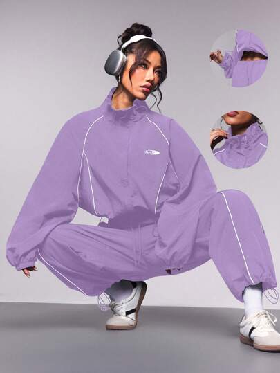 Streetz SHEIN Sport طقم رياضي للنساء يتكون من ملابس علوية ذات تصميم ألوان مركبة والبنطلون الرياضي، قطعتان