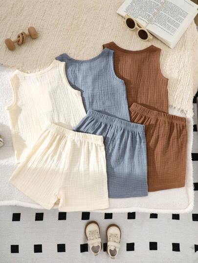 SHEIN Vintaside Kids طقم صيفي للأطفال الصبيان 6 قطع، ملابس علوية أكمام بلا أكمام بلون أحادي مطابق مع شورت، 3 طقوم باللون البني والمشمش والأزرق، فضفاض، مناسب للمنزل والأوقات الحرة والخروج والمناسبات