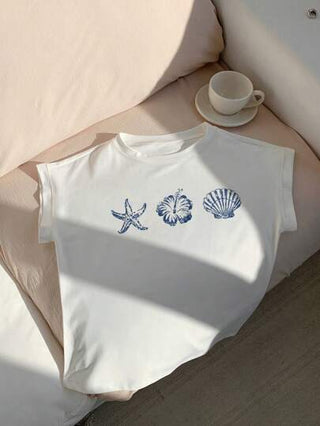 Comfortcana ملابس علوية نسائي بأكمام قصيرة وطباعة أزهار بحرية وأصداف وكواكب البحر، بأسلوب متساهل، مناسب للصيف والإجازات والملابس البحرية وعطلة الربيع والرحلات مع الصديقات والعودة إلى المدرسة