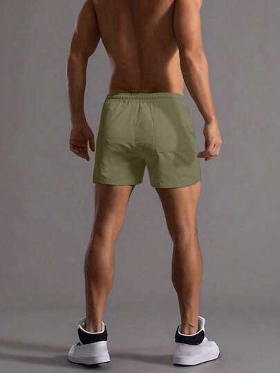 Manfinity Homme شورت رجالي صيفي فضفاض مطاطي الخصر بلون سادة