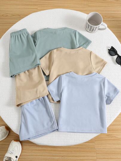 SHEIN 6 قطع مجموعة قميص كم قصير مطبوع بالأحرف وشورت خصر مطاطي للأولاد/البنات، لون أساسي جميل، ملابس ربيعية وصيفية