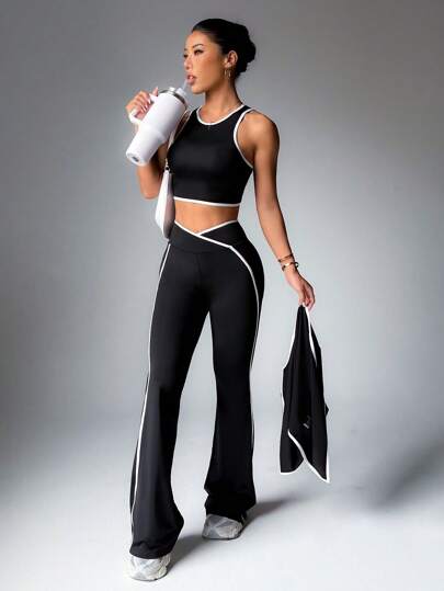 SHEIN Sport Studio طقم بدلة رياضية بلباس علوي بدون أكمام وبنطال مع تريم متباين
