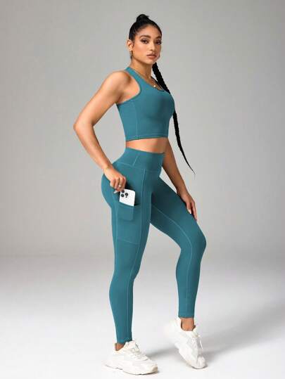 SHEIN Sport Studio طقم رياضي للنساء يتكون من ملابس علوية ذات ظهر متقاطع بلون واحد والسراويل الضيقة