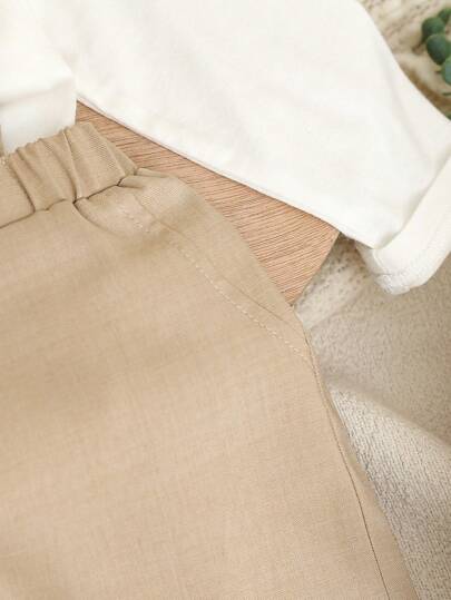 SHEIN مجموعة ثوبين طفل صبي مرحلة الحضانة ذو طابع رسمي على شكل رجل أنيق، تتضمن قميص كم طويل أبيض بياقة و فيونكة ، وبنطلون كاجوال بأربطة ،مناسب للحفلات العصرية ، ليلة المولد ، المناسبات الرسمية ، الزفاف ، والأعياد ، مناسب للربيع والخريف