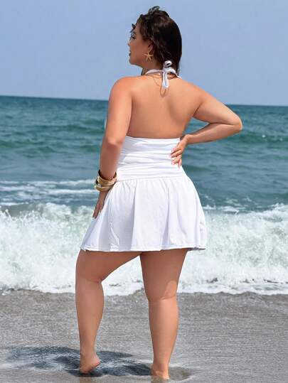 SHEIN Swim Curve مجموعة تانكيني من الياقة العالية الظهر المفتوح والتنورة القصيرة المطوية باللون الكامل الحجم الكبير
