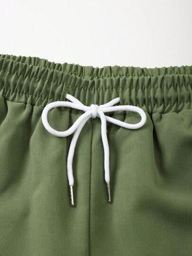 Manfinity Swimmode طقم قميص أكمام قصيرة مطبوع بالنباتات وشورت للرجال لأجازة الصيف