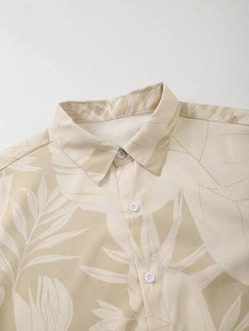 Manfinity Swimmode طقم صيفي رجالي مكون من قميص وشورت بطبعة نباتية على الجسم بأكمام قصيرة وأزرار أمامية، مناسب للشاطئ والأجواء الصيفية