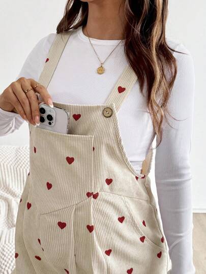 SHEIN جمبسوت سائبة بجيوب وبطبعة قلب مناسبة للحوامل