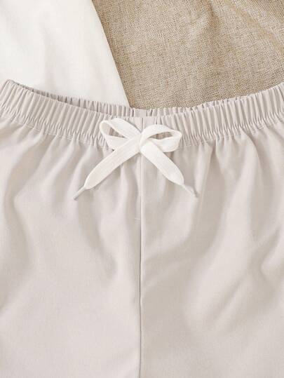 SHEIN Streecool Kids مجموعتان من قميص كاجوال بأكمام قصيرة وسروال صغير الحجم للأولاد ذو لونين متباينين وجيوب حمولة