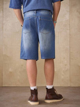 Manfinity Homme شورت جينز كاجوال فضفاض مبهت بتأثير مستهلك باللون الأزرق الفاتح