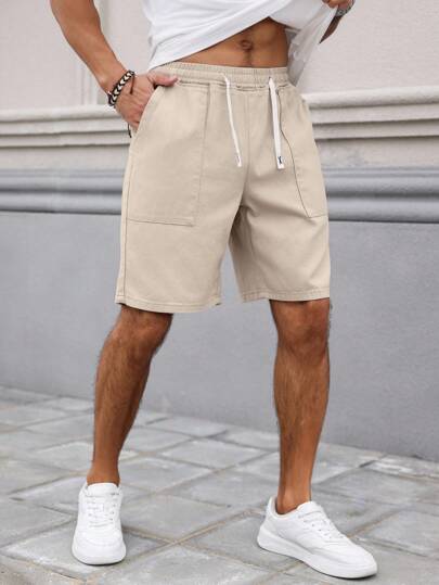 Manfinity Homme شورت جينز رجالي مريح بخصر مطاطي ولون سادة ممزقة باللون الكريمي، مناسب لفصلي الربيع والصيف والاستجمام