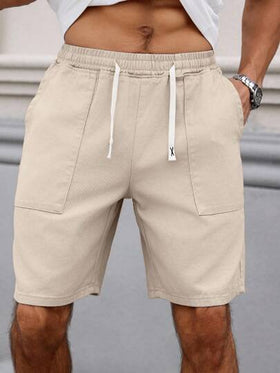 Manfinity Homme شورت جينز رجالي مريح بخصر مطاطي ولون سادة ممزقة باللون الكريمي، مناسب لفصلي الربيع والصيف والاستجمام