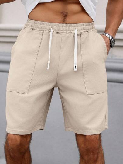 Manfinity Homme شورت جينز رجالي مريح بخصر مطاطي ولون سادة ممزقة باللون الكريمي، مناسب لفصلي الربيع والصيف والاستجمام