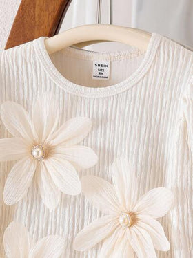 SHEIN مجموعة بنطال وبلوزة طويلة الأكمام للبنات المراهقات، تتكون من 2 قطعة: ملابس علوية شيفون بياقة دائرية وأكمام طويلة باللون المشمشي، وبنطال أنيق مزين بأزرار اللؤلؤ والزهور، مناسبة للخريف والشتاء