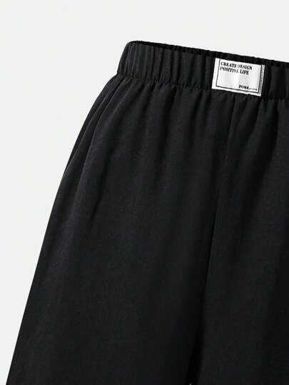 SHEIN Explorewe بنطلون فضفاض مرن الخصر من قماش منسوج للمراهقات، متعدد الاستخدامات للعودة إلى المدرسة، بنطلون أسود فضفاض وفضفاض للخريف والشتاء