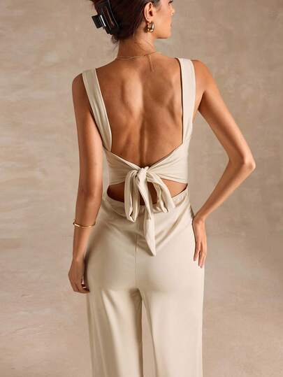 SHEIN BAE جمبسوت نسائية أنيقة وجذابة بحمالات رفيعة وساقين واسعتين باللون الأسود الصلب مع تصميم ظهر مكشوف وفيونكة، مناسبة للارتداء اليومي والمناسبات والخروجات والحفلات والتجمعات، ملابس طبقية أنيقة للنساء، ملابس للخروج، عيد الحب، كاجوال، أنيقة، عطلة