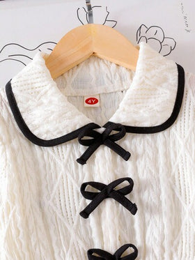 SHEIN Elladie kids مجموعة من قطعتين: ملابس علوية بأكمام متسعة بيضاء مزينة بفيونكة سوداء وبنطلون أسود كاجوال مريح وفضفاض