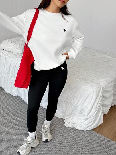 SHEIN EZwear مجموعة من 2 قطعة: بلوزة رياضية فضفاضة بياقة طاقم وبنطلون ضيق