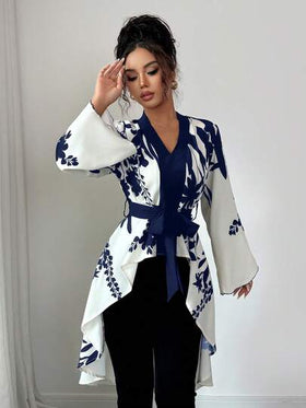 قميص فرنسي أنيق بأكمام طويلة وخصر مشدود وذيل سمكة مطبوع بتصميم متناظر باللونين الأسود والبيج