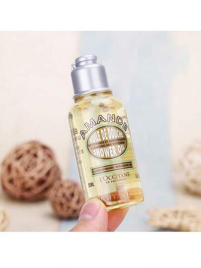 L'Occitane زيت دش لوكسيتان الأمند | 35 مل حجم صغير، مُزود ببشور اللوز، مرطب وناعم لجلود الجافة، لاستخدام يومي