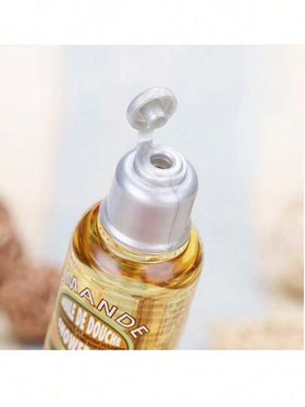 L'Occitane زيت دش لوكسيتان الأمند | 35 مل حجم صغير، مُزود ببشور اللوز، مرطب وناعم لجلود الجافة، لاستخدام يومي