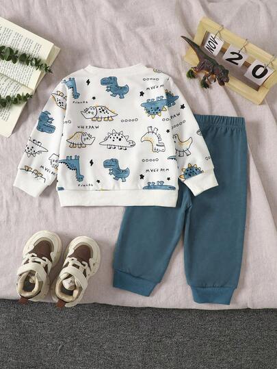 SHEIN Playful Pals مجموعة ملابس علوية بياقة مستديرة بطبعة ديناصور وبنطلون أخضر سادة مناسبة للأطفال الصبية، مناسبة للعب في الخارج والملابس الكاجوال والرياضية، للربيع والخريف