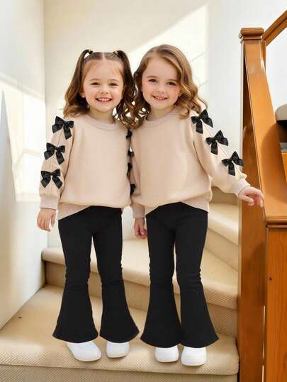 Emery Rose Kids Emery Rose Kids طقم ملابس بناتي مكون من قطعتين، سويت شيرت كاجوال بياقة دائرية بلون سادة مع بنطال ضيق، طقم ملابس بناتي من أسفل جرس، طقم ملابس بناتي من قطعتين، ملابس بناتي في سن المراهقة، طقم ملابس بناتي من قطعتين، لباس علوي وبنطال بأكمام في