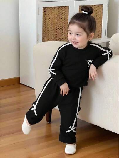 Genkimix Kids مجموعة بدلة رياضية كاجوال للفتيات من عمر 4-7 سنوات، تتكون من بلوزة وبنطلون بتصميم فيونكة باللون البنفسجي، مناسبة للخريف