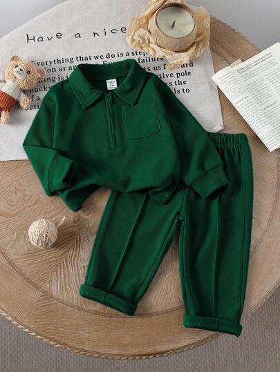 SHEIN ملابس كاجوال للأطفال الرضع ذكور/إناث، دافئة ومريحة للطقس المعتدل. ملابس علوية كم طويل ذات ياقة نصف سحاب بلون واحد، تصميم بلوفر سهل الارتداء؛ مقترنة بسروال بخصر مرن بلون واحد. مناسبة للتنزه والراحة والتمارين الخفيفة والتجمعات العائلية، تبرز براءة الط