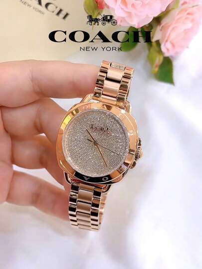 Coach ساعة تاتوم النسائية بمينا ذهبي وردي
