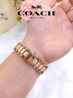 Coach ساعة تاتوم النسائية بمينا ذهبي وردي
