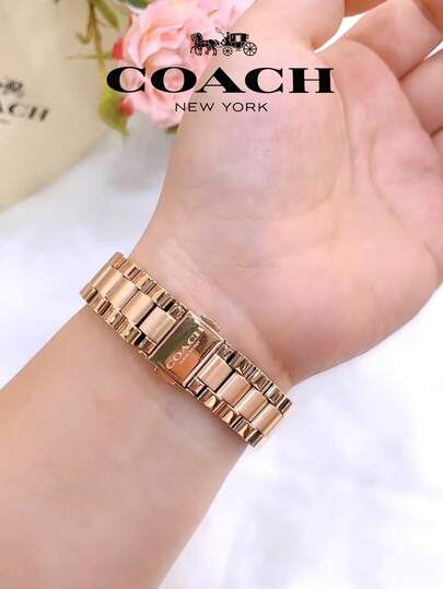 Coach ساعة تاتوم النسائية بمينا ذهبي وردي
