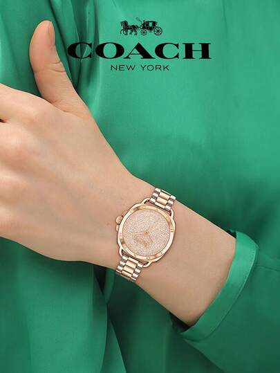 Coach ساعة تاتوم النسائية بمينا ذهبي وردي