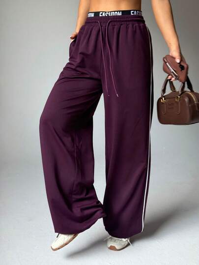 أفضل مبيع! بنطلون كاجوال ذو خصر مطاطي وساق واسعة مع خطوط جانبية باللون الأحمر ، مريح وقابل للتنوع