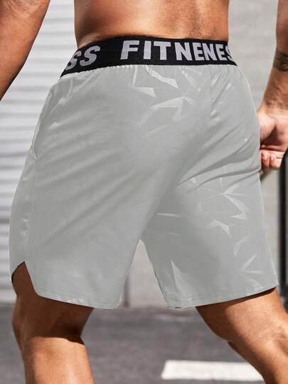 Manfinity Sport Corelite شورتات رياضية للرجال ذات طباعة هندسية وحروف على الخصر