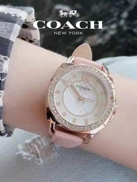 Coach ساعة نسائية بسوار جلدي وردي ومينا أبيض من عرق اللؤلؤ