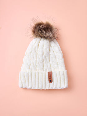 Hatastic قبعة بيني محبوكة للنساء 1 قطعة مع شعار من الجلد، قبعة دافئة مسمكة للأنشطة الخارجية هدايا عيد الميلاد