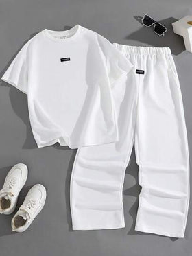 SHEIN مجموعة بنطلون وتيشيرت بأكمام قصيرة وياقة دائرية بتصميم كاجوال وشارع مناسب للمراهقات، مريح ومتعدد الاستخدامات للتنقل والمدرسة والاستخدام اليومي والعطلات والتدريب والحفلات، مناسب للربيع والصيف